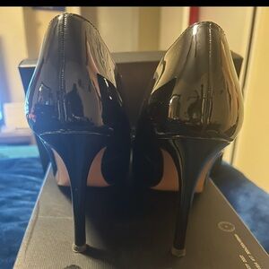 Sleek patent leather black heels